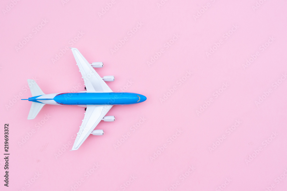 Fototapeta Plane on pink background with copy space