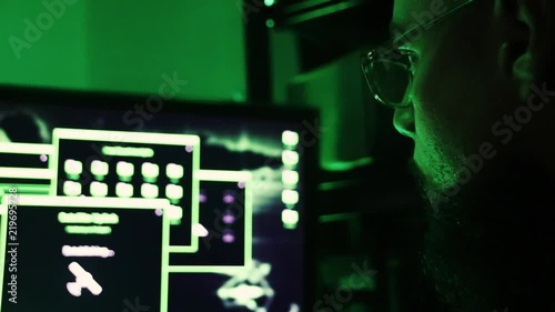 A hacker in front of his screen - stilling all informations from gouvernement after a sucessfull cracking
