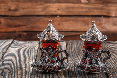 Fragrant Turkish tea and Turkish sweets in national dishes photo