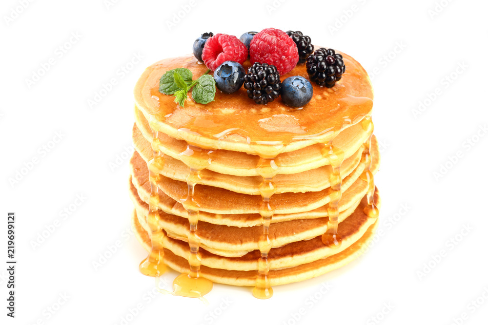 Pancakes stack with different berries and honey isolated on white background - obrazy, fototapety, plakaty 