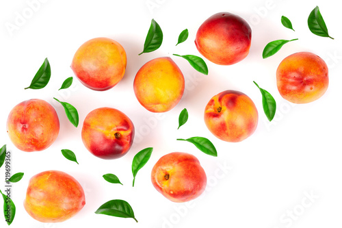 Fototapeta Naklejka Na Ścianę i Meble -  ripe nectarine with leaves isolated on white background with copy space for your text. Top view. Flat lay pattern