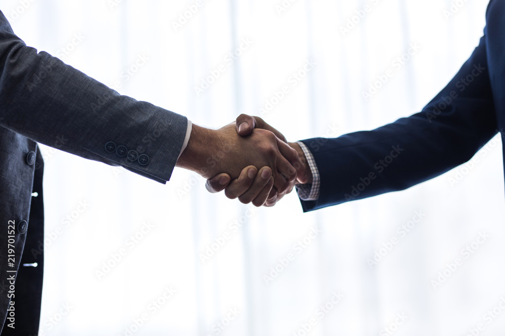 Successful business associates shaking hands Successful business associates shaking hands