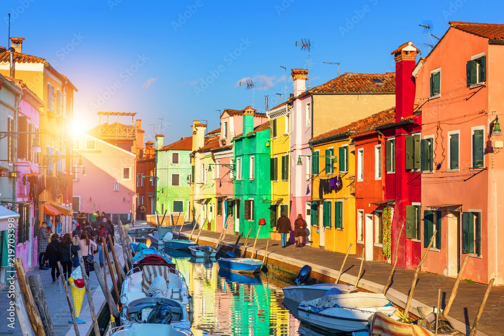 Lovely house facade and colorful walls in Burano, Venice. Burano island canal, colorful houses and boats, Venice landmark, Italy. Europe