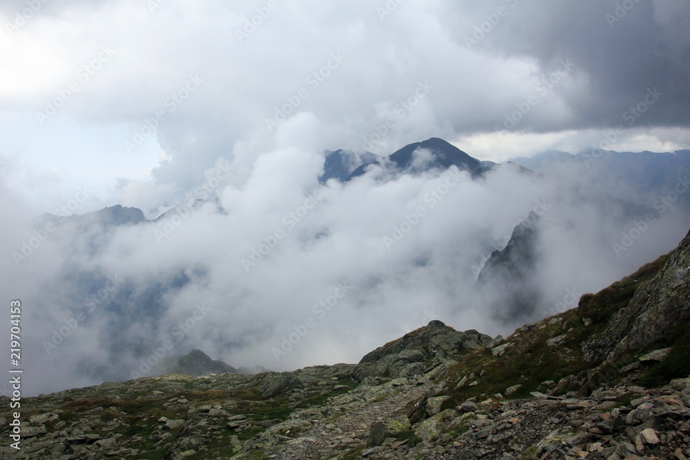 Summit surrounded by clouds Summit surrounded by clouds