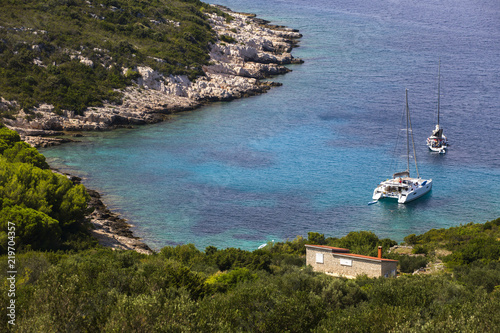 Boats in Vela Svitnja cove, Vis island - Croatia photo