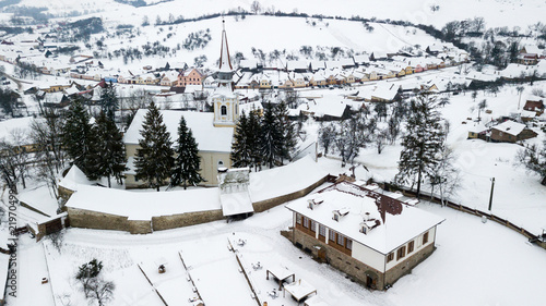 Aerial view of an old village in Romania during winter time