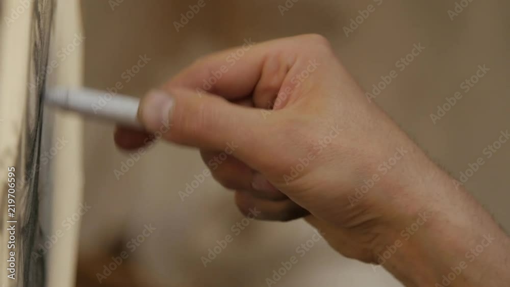 Artists hands drawing wooden pencil. Close up. Artists hands drawing wooden pencil. Close up.