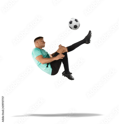 soccer player kicking the ball in the air isolated on white