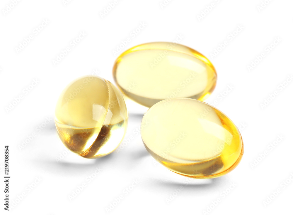 Cod liver oil pills on white background Cod liver oil pills on white background