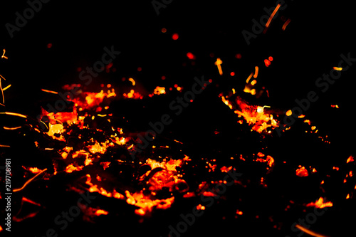 Flame of fire with sparks on a black background