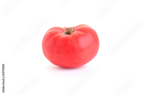 Red, juicy tomato on a white background.
