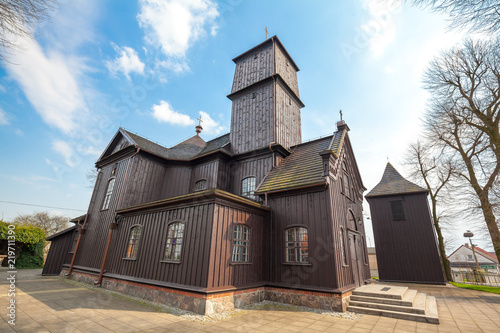 Obraz na płótnie Wooden church from 1776 year in cozy village center Leki Wielkie in Greater Poland province w salonie