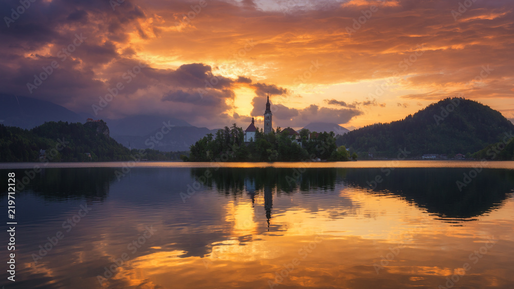 Lake Bled Slovenia. Beautiful sunrise over Bled lake with small Pilgrimage Church. Most famous Slovenian lake and island Bled with Pilgrimage Church of the Assumption of Maria. Bled, Slovenia.