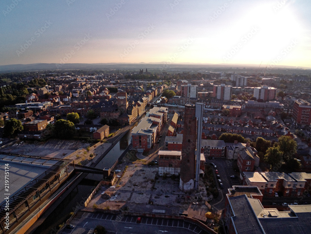 Aerial view, drone panorama of Chester city during sunset sun close to canal, old shot tower and steam mill area