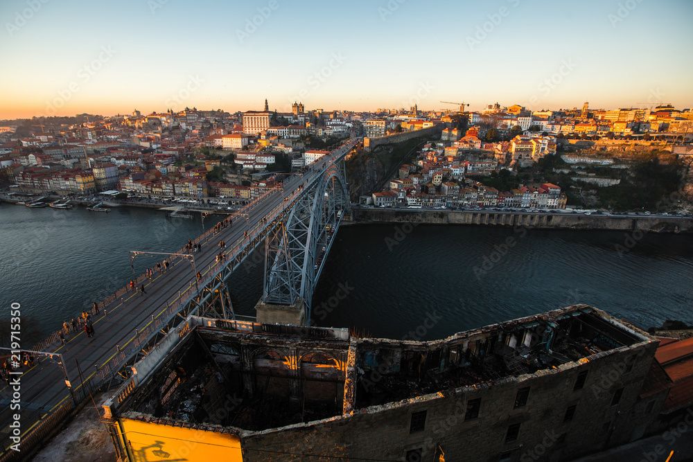 View of Douro river and Dom Luis I bridge at dusk, Porto, Portugal.