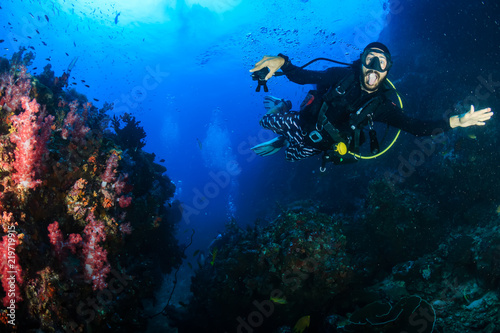 SCUBA diver on an underwater tropical coral reef