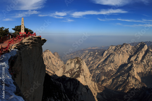 Huashan, Mount Hua - Huayin, near Xi'an in Shaanxi Province China. Shrine at the top of a Cliff with Steep Vertical Drop-off, Famous yellow granite mountains of China, UNESCO World Heritage. Panoramic photo