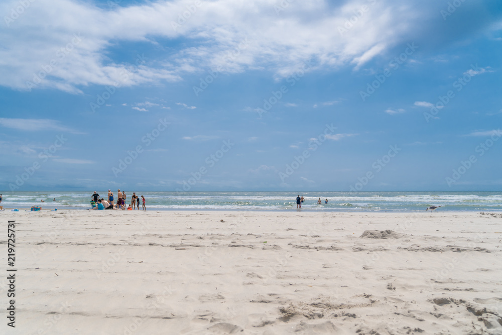 Wildwood New Jersey Beach on Beautiful Blue Sky and Clouds with People on the Shoreline