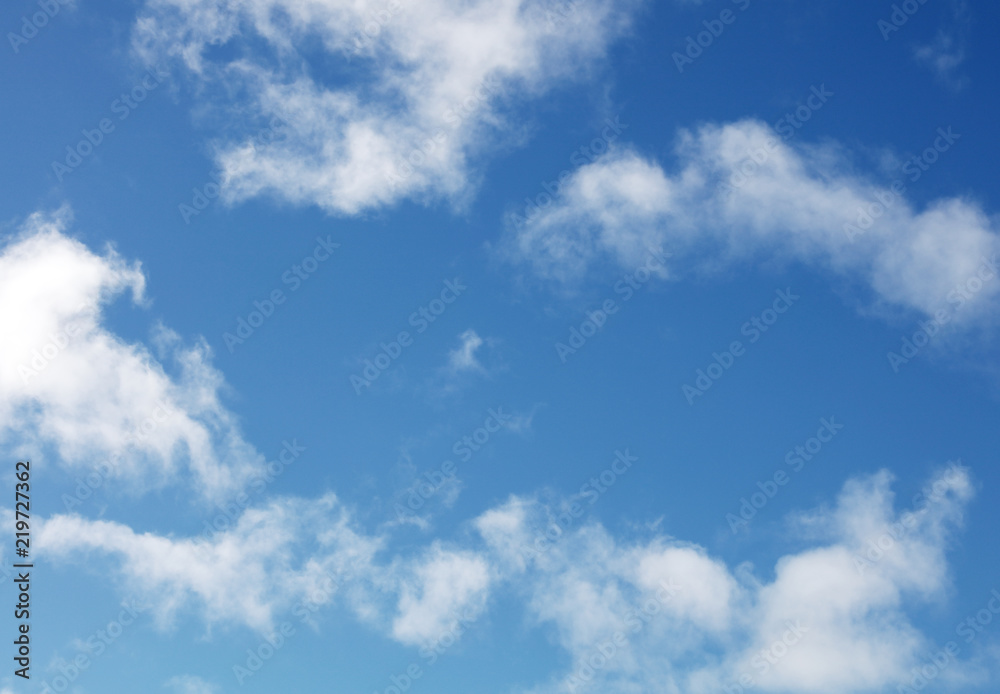 White fluffy clouds in blue sky