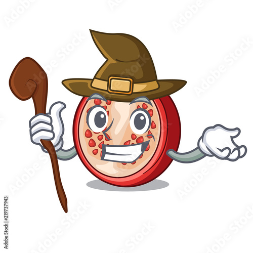 Witch mascot half of fresh pomegranate fruits