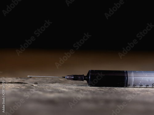narcotic syringe on the floor. Anti drug concept.