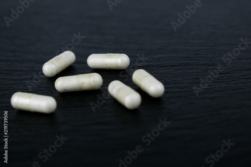 Tablets and the begun packing on a dark background.