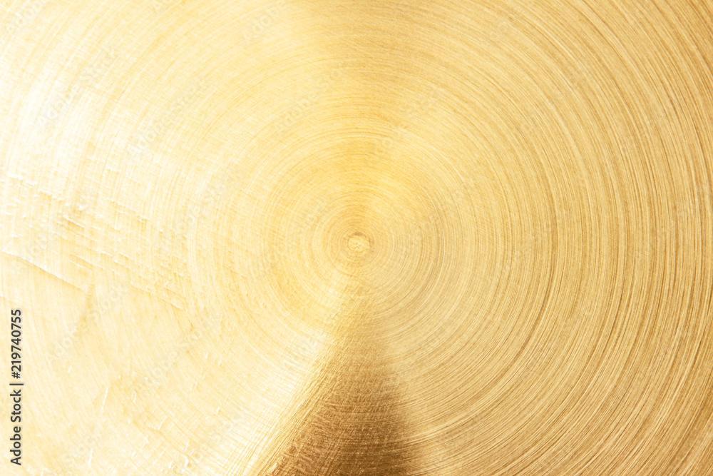 Abstract Gold polished metal brushed background or Shiny yellow leaf gold steel texture. Brushed metal plate with reflected light golden. Abstract Gold polished metal brushed background or Shiny yellow leaf gold steel texture. Brushed metal plate with reflected light golden.