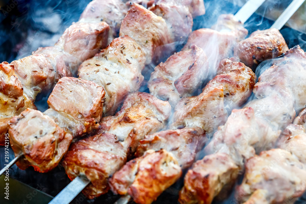 Barbecue skewers with meat on the brazier. Pork shish kebab