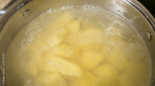 Cut potatoes in a saucepan with starting water to boil.