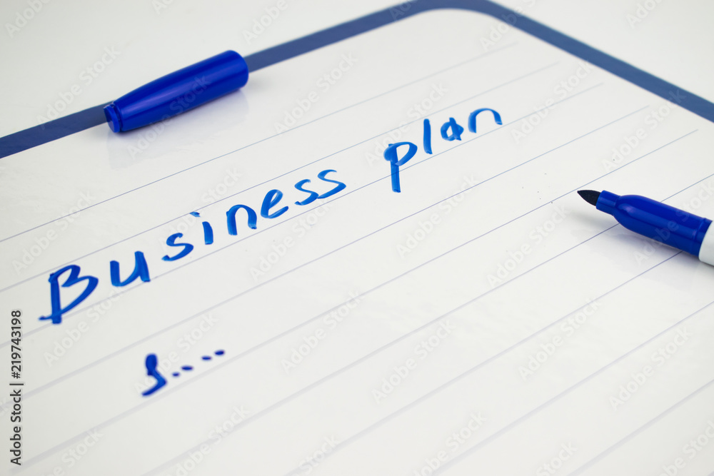 Beginning of drafting a business plan with a blue marker. Beginning of drafting a business plan with a blue marker.