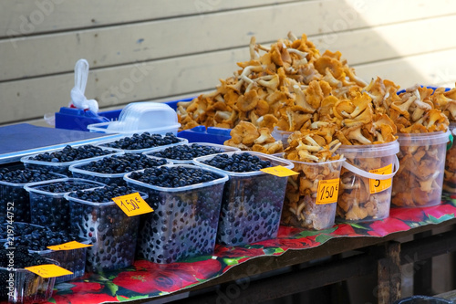 Market shelf with mushrooms and berries. Latvia