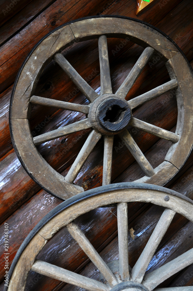 Two wooden wheels to the cart