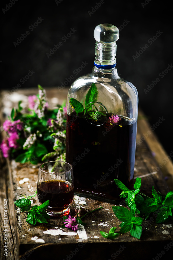 Bitter tincture with mint and clover.style rustic Bitter tincture with mint and clover.style rustic