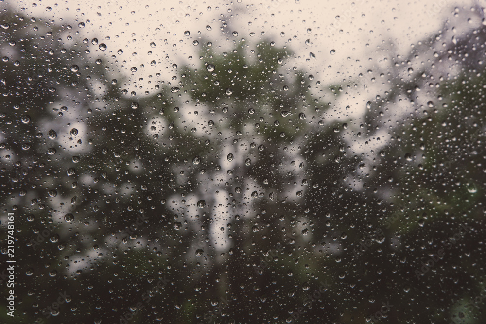 Car glass covered with drops of autumn rain. Web banner. Element of design
