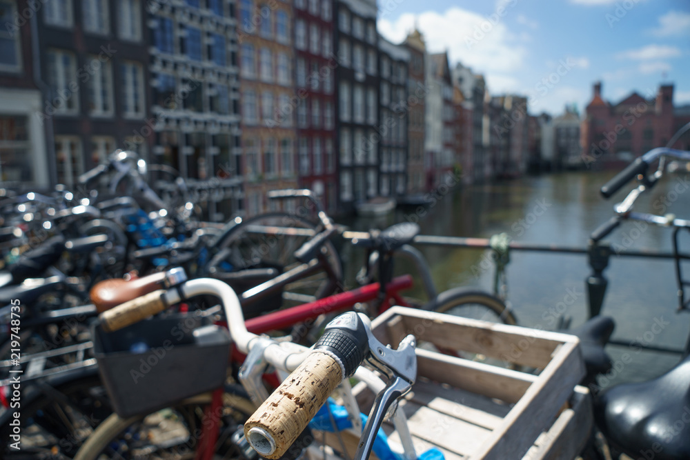 Bicycle over blurred canal of Amsterdam