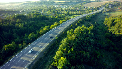 road for cars aerial view from top around green nature