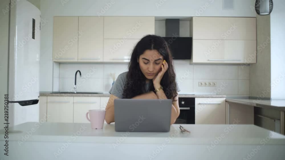 Beautiful woman is watching a movie on her notebook Beautiful woman is watching a movie on her notebook