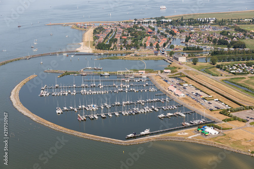 Aerial view Dutch village Stavoren at lake IJsselmeer with marina harbor and residential area