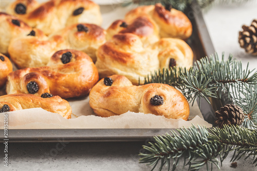 Traditional Swedish Christmas saffron buns (lussebulle or lussekatt). Swedish christmas. photo