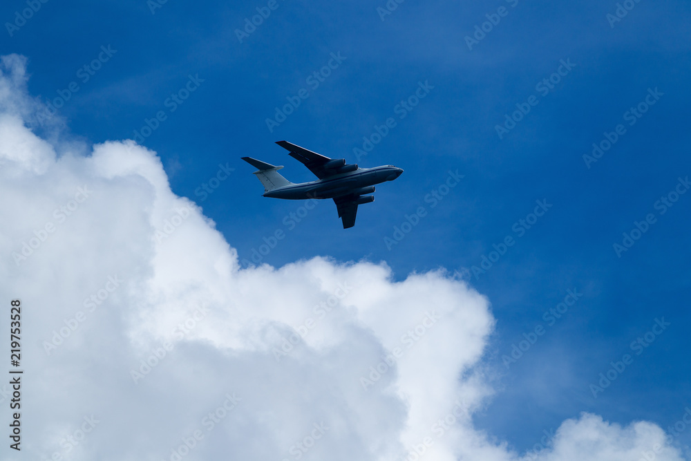 Blue sky with clouds and flying airplane Blue sky with clouds and flying airplane