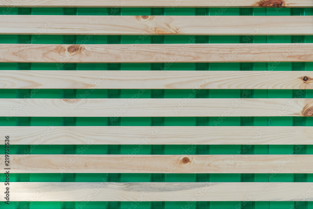 horizontal wooden planks on green, full frame background