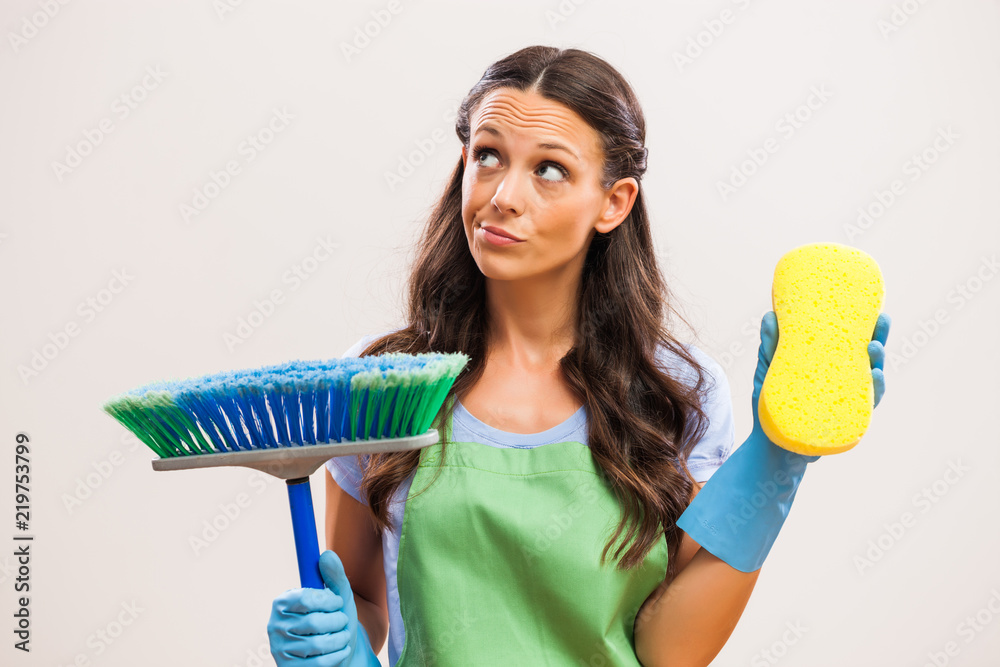Portrait of housewife who doesn't like cleaning. Portrait of housewife who doesn't like cleaning.