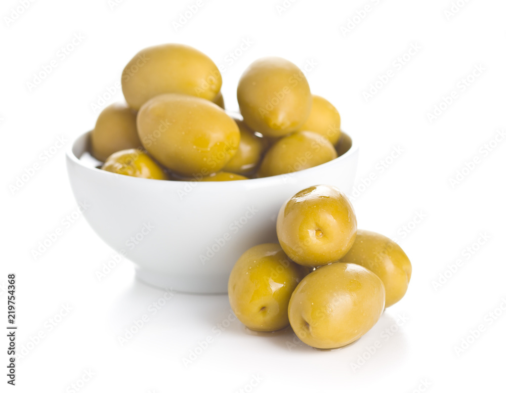 Green olives in bowl. Green olives in bowl.