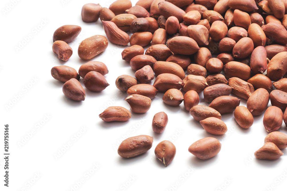 Pile of raw peeled peanuts isolated on white Pile of raw peeled peanuts isolated on white