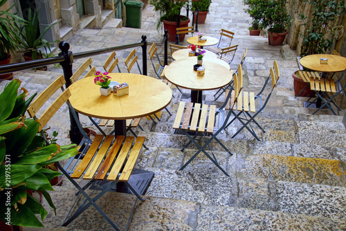 Outdoor restaurant table and chairs photo