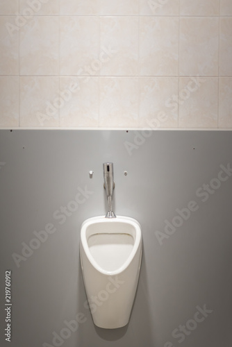 Close up of urinal men public toilet, Closeup white urinal in men's bathroom, design of white ceramic urinal for men in toilet room.