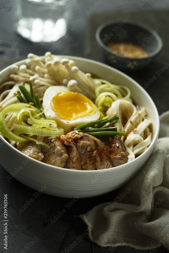 Asian style soup with noodles, egg, meat and mushrooms Asian style soup with noodles, egg, meat and mushrooms