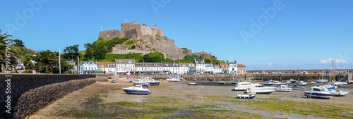 The seaside village of Gorey with Mont Orgueil castle on the island of Jersey photo