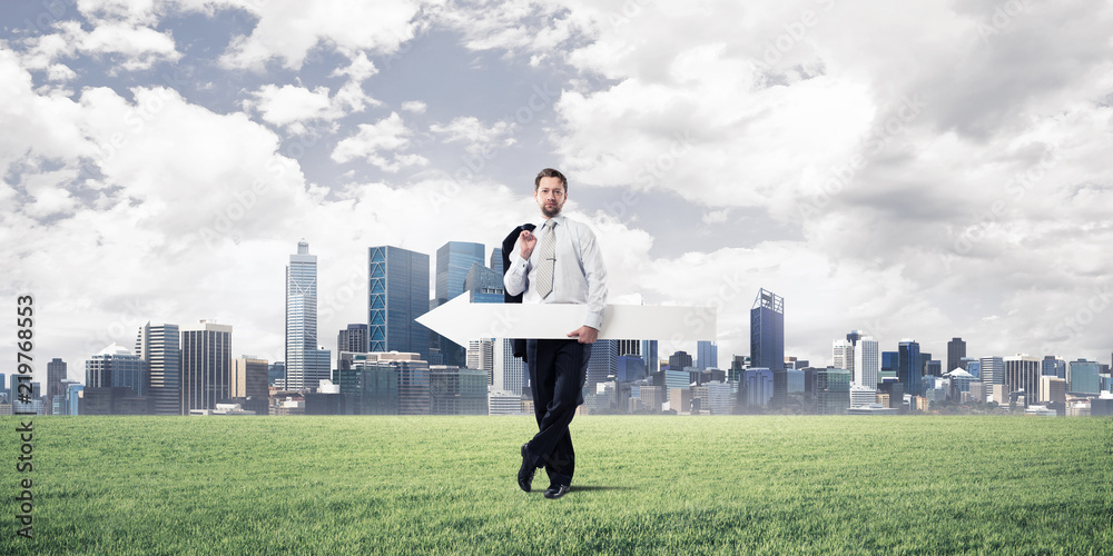 Conceptual image of businessman pointing aside