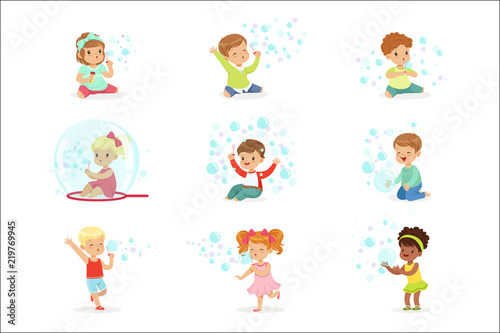Children playing with colorful soap bubbles, holiday show of soap bubbles at a children party
